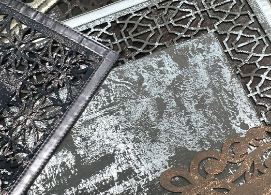 Bianca: Elegant leather look carpet with classical and modern bordures