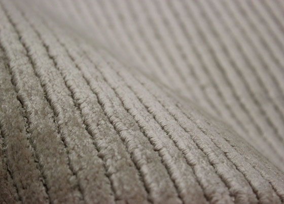 Softline: The labor intensive carpet weaved on special looms with natural viscose and put through hand made carpet processes subsequent to weaving