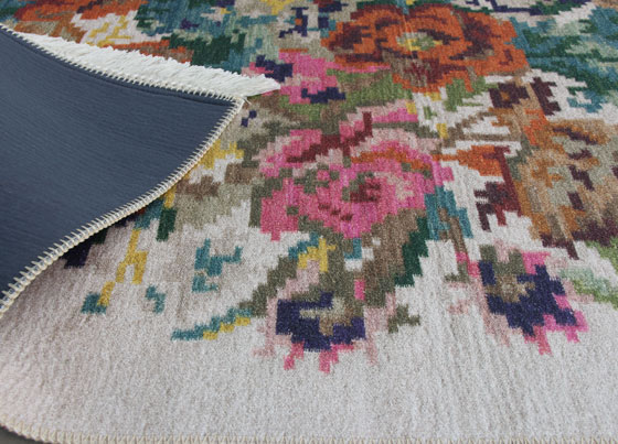 Siesta: Produced with printed technique on to the %100 Polyester fabric 
For giving a hand made rug flexibility and weightiness, special weaved cotton kilims has used under the polyester fabric - backing is covered