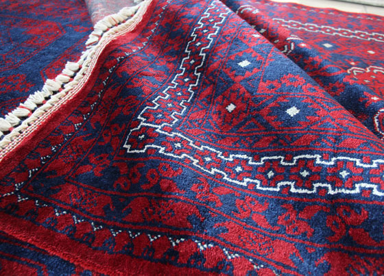Nostalji: The labor intensive rug weaved on special looms with wool and tencel and put through hand made rug processes subsequent to weaving - inspired and created from traditional rug making skills of women from Ushak region
